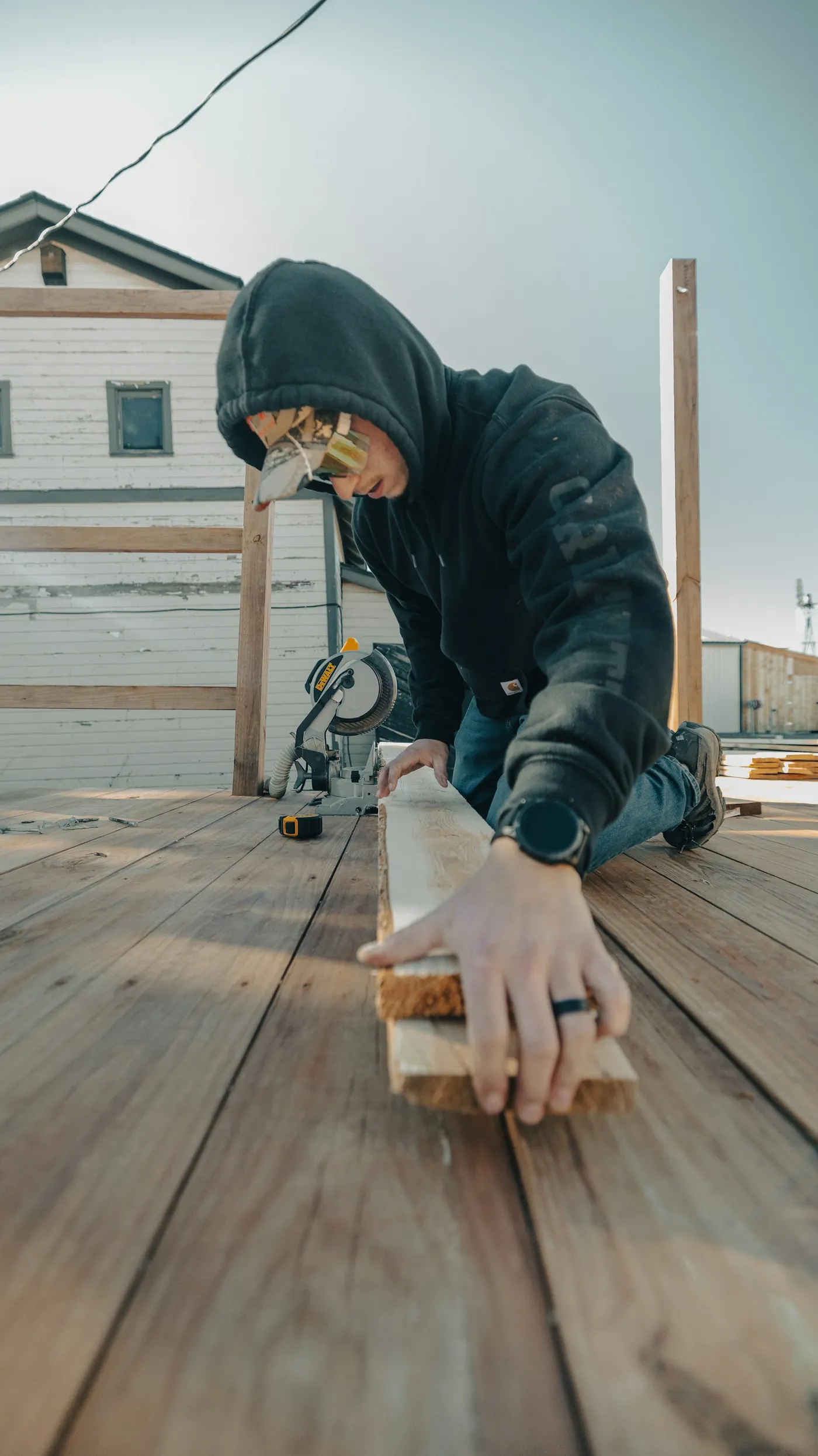 Building a wooden deck at a home, natural light